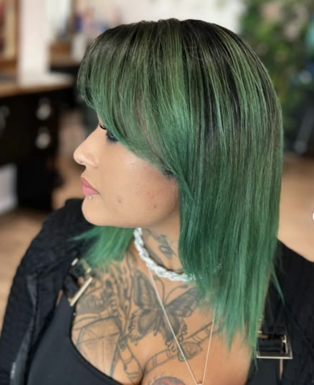 Client result with vivid green precision cut photographed inside Daniel Jordan Salon South.